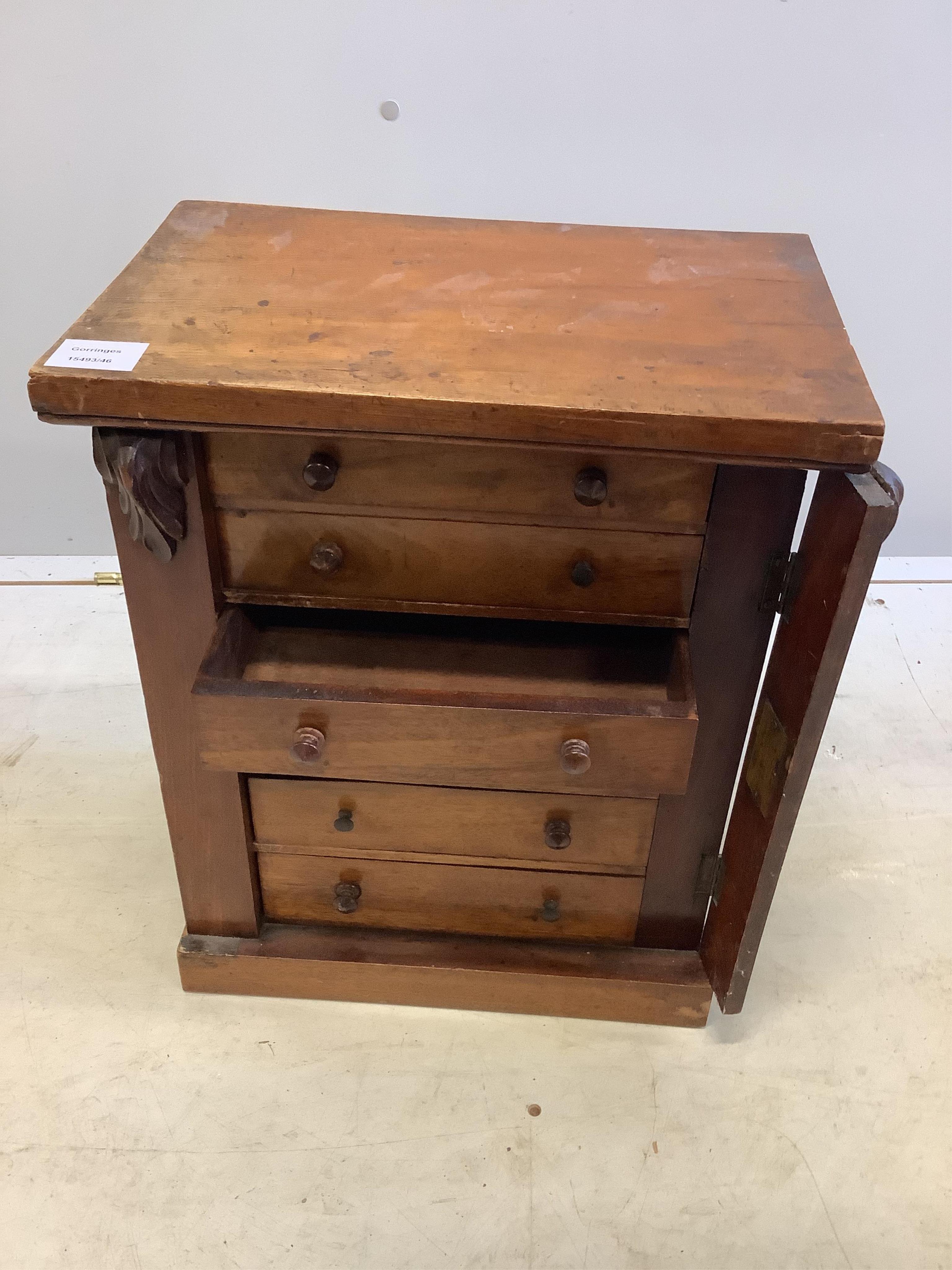 A late Victorian mahogany miniature Wellington chest, width 38cm, depth 25cm, height 46cm. Condition - poor to fair